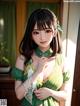 A woman in a green dress is posing for a picture.